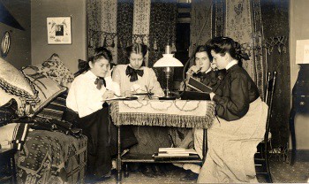 Studying around a Welsbach gas burner in Main building, circa 1905.